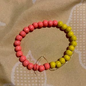 Pink , yellow bracelet.